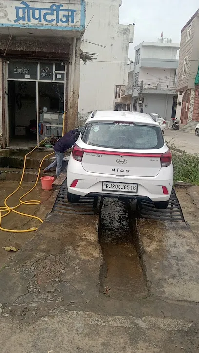 Char bhuja car washing centre and travel agency