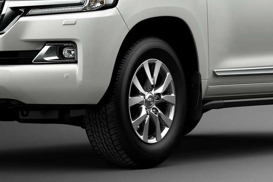 Toyota Land Cruiser 200 The Toyota SUV stands on 10-spoke 18-inch alloy wheels that are wrapped in spare-ground types.