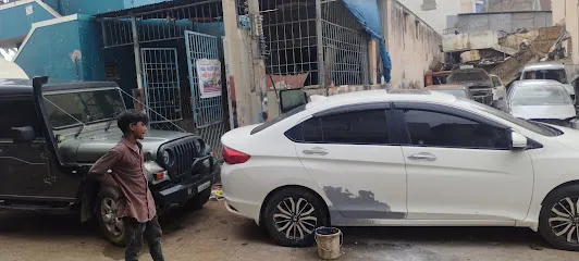 Asif Tinkering and painting(garage)