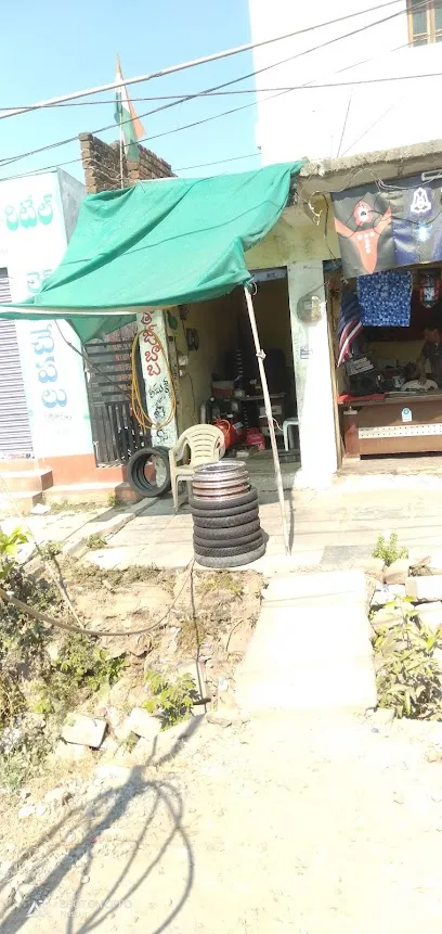 NASPUR TAJ Baba Bike Rim Throw Work Shop And Tyres