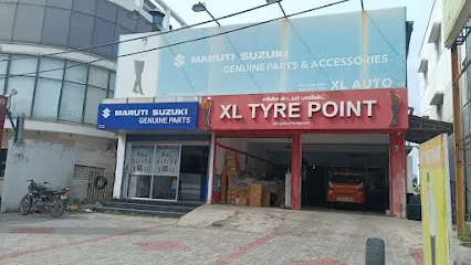 XL TYRE POINT (MTH ROAD, THIRUMULLAIVOYAL) BATTERY, TWO WHEELER AND CAR TYRE DEALER