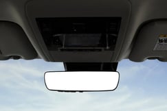 Toyota Land Cruiser 200 The Land Cruiser offers an overhead storage compartment. Also, seen in the image is the inner rearview mirror with an auto-dimming feature.